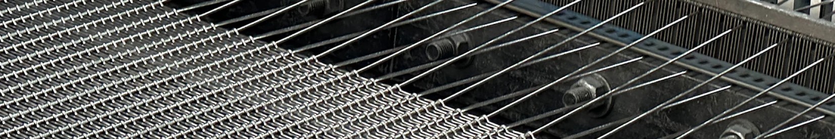 Black chain link fence separating a construction work area