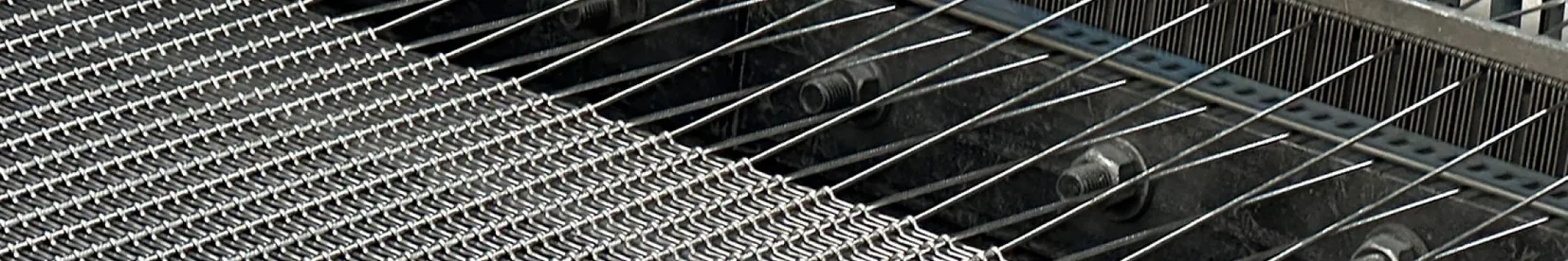 Black chain link fence separating a construction work area